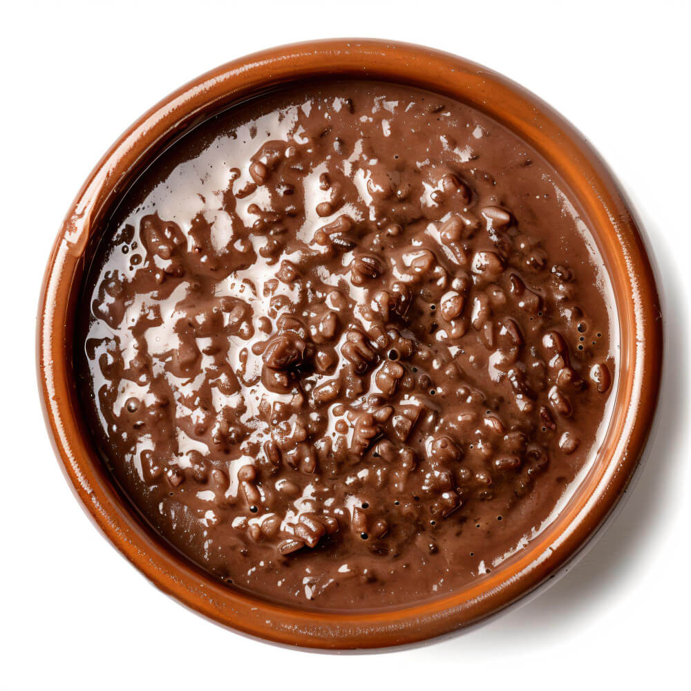 A bowl of classic Filipino champorado, a rich chocolate rice porridge.